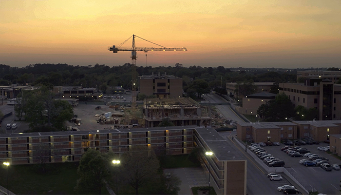 Aerial View of SHSU campus with cranes during dawn